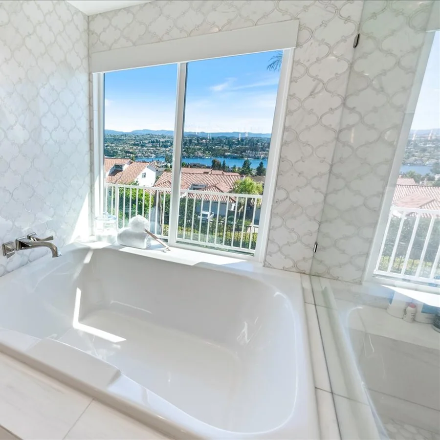 Primary bath remodel with arabesque marble tile and Lake Mission Viejo views — coordinated by Coto Bath Co.